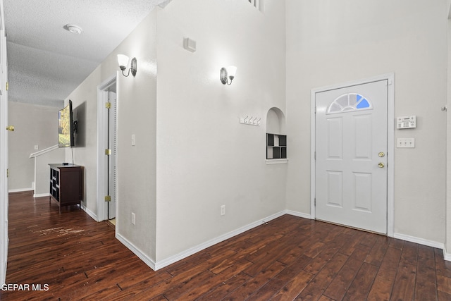 3501 Al Roberts Dr, El Paso, TX 79936 - foyer entrance with hardwood / wood-style flooring, baseboards, and a textured ceiling