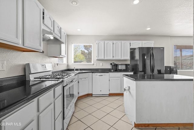 3501 Al Roberts Dr, El Paso, TX 79936 - kitchen featuring plenty of natural light, white cabinetry, and black appliances