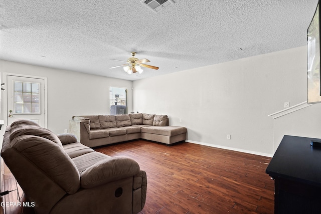3501 Al Roberts Dr, El Paso, TX 79936 - living room featuring baseboards, a textured ceiling, visible vents, ceiling fan, and hardwood / wood-style flooring