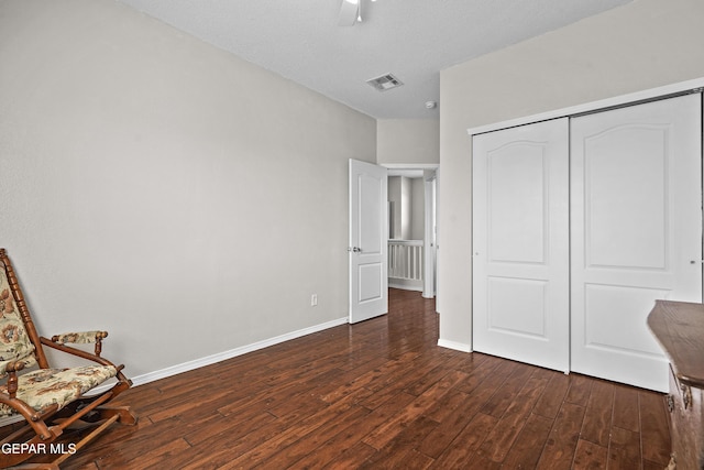 3501 Al Roberts Dr, El Paso, TX 79936 - unfurnished bedroom with ceiling fan, dark wood-type flooring, a closet, visible vents, and baseboards