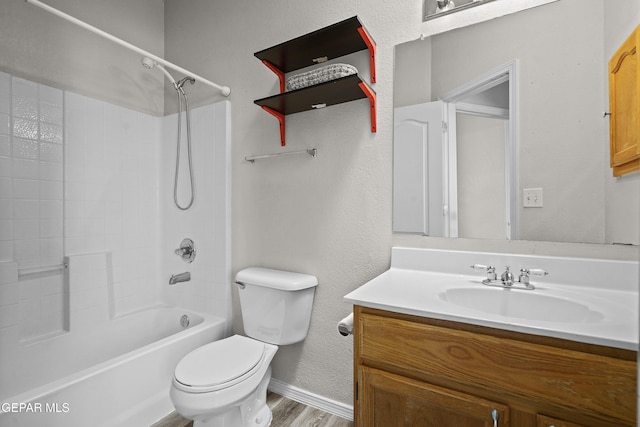 3501 Al Roberts Dr, El Paso, TX 79936 - bathroom featuring shower / bathing tub combination, vanity, toilet, wood finished floors, and baseboards