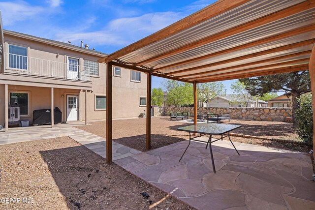 3501 Al Roberts Dr, El Paso, TX 79936 - view of patio featuring outdoor dining area, a balcony, and fence