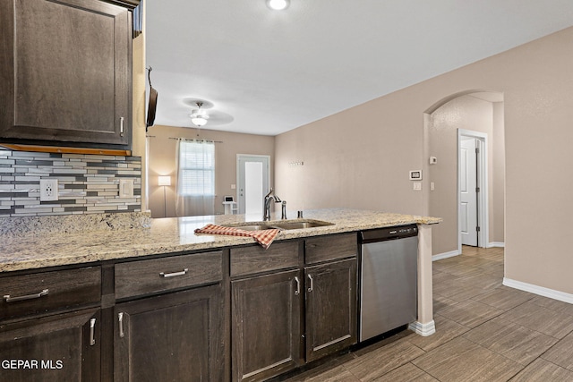 14439 Eastbrook Dr, El Paso, TX 79938 - kitchen with a sink, stainless steel dishwasher, decorative backsplash, and dark brown cabinetry