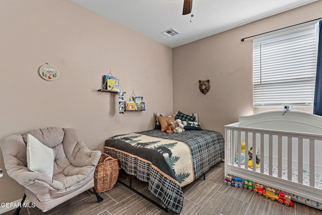 14439 Eastbrook Dr, El Paso, TX 79938 - bedroom featuring visible vents, a ceiling fan, and wood finish floors