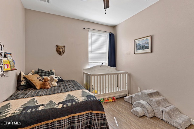 14439 Eastbrook Dr, El Paso, TX 79938 - bedroom featuring visible vents, ceiling fan, and wood finished floors