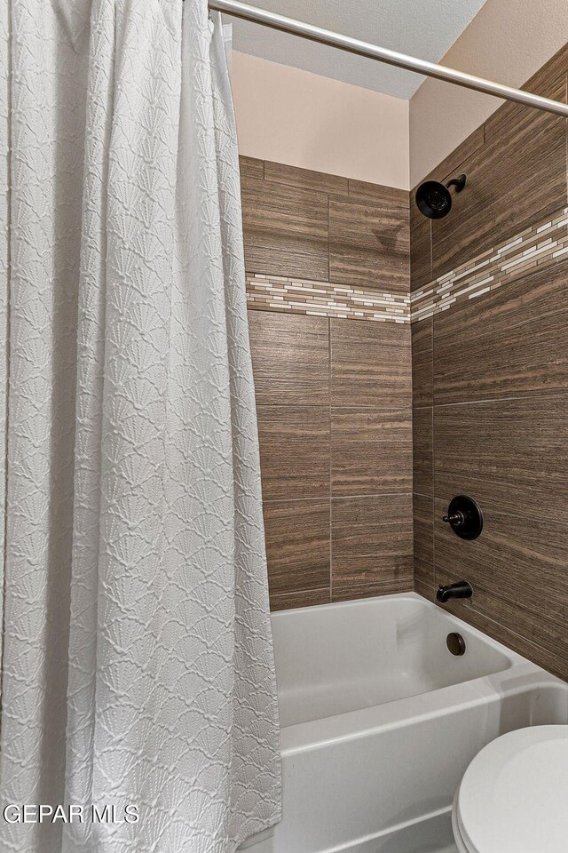 14439 Eastbrook Dr, El Paso, TX 79938 - bathroom with shower / bath combination with curtain and toilet
