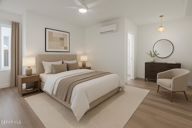 3600 Essence St, El Paso, TX 79938 - bedroom with a wall mounted air conditioner, light wood-style floors, baseboards, and ceiling fan