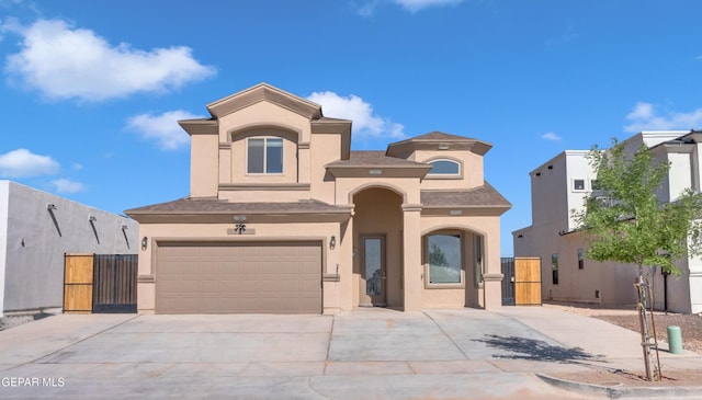 3600 Essence St, El Paso, TX 79938 - mediterranean / spanish home with a gate, driveway, a garage, and stucco siding