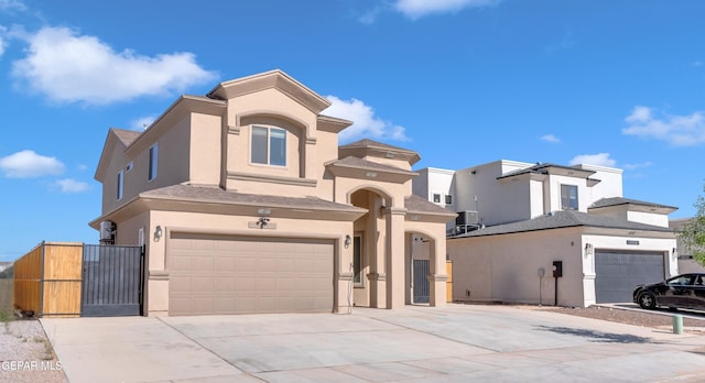3600 Essence St, El Paso, TX 79938 - view of front of home featuring a garage, concrete driveway, and stucco siding