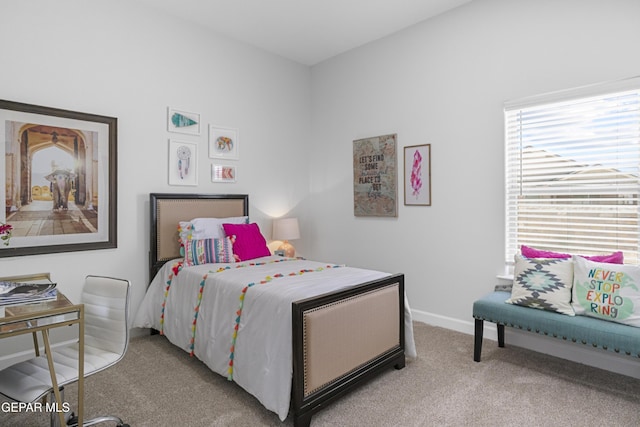bedroom featuring carpet floors and baseboards