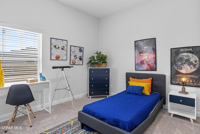 carpeted bedroom with baseboards