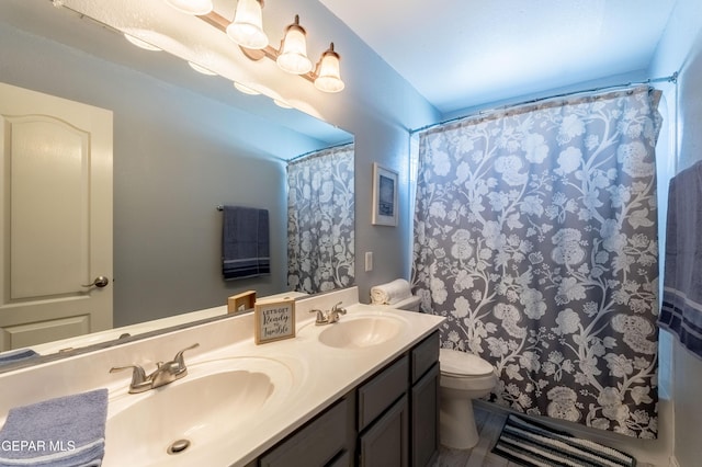 400 Rio Fango, El Paso, TX 79932 - bathroom featuring a sink, toilet, double vanity, and curtained shower