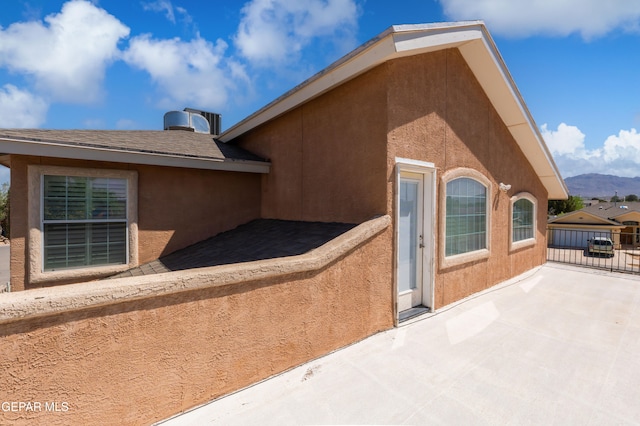 400 Rio Fango, El Paso, TX 79932 - view of property exterior with a patio, a mountain view, stucco siding, and fence