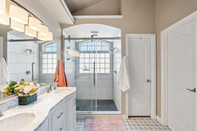 400 Rio Fango, El Paso, TX 79932 - bathroom featuring tile patterned floors, double vanity, a sink, and a stall shower