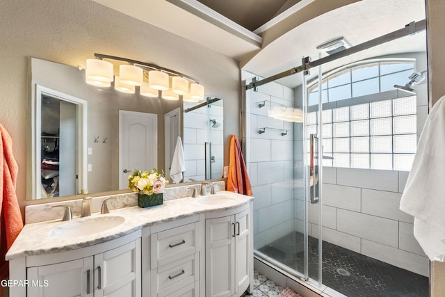 400 Rio Fango, El Paso, TX 79932 - bathroom with a sink, a shower stall, and double vanity