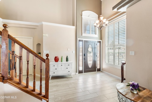 400 Rio Fango, El Paso, TX 79932 - entrance foyer featuring baseboards, stairway, a high ceiling, and an inviting chandelier