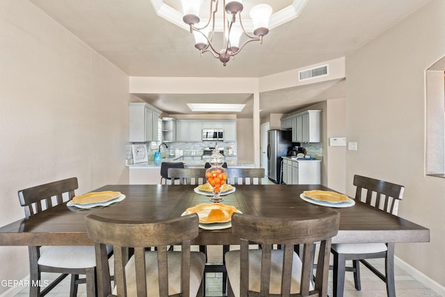 400 Rio Fango, El Paso, TX 79932 - dining area featuring a chandelier, baseboards, and visible vents