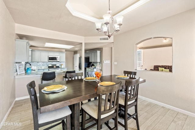 400 Rio Fango, El Paso, TX 79932 - dining area featuring a raised ceiling, light wood finished floors, baseboards, and visible vents