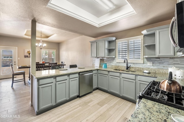 400 Rio Fango, El Paso, TX 79932 - kitchen with a raised ceiling, appliances with stainless steel finishes, a sink, and open shelves