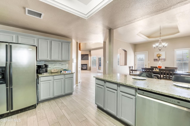 400 Rio Fango, El Paso, TX 79932 - kitchen featuring gray cabinets, appliances with stainless steel finishes, a chandelier, and visible vents