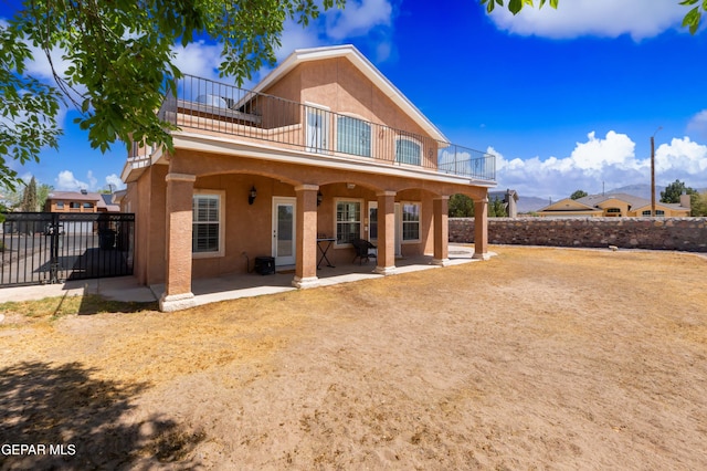 400 Rio Fango, El Paso, TX 79932 - rear view of property with a patio area, stucco siding, fence, and a balcony