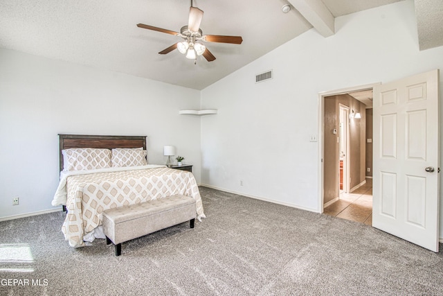 carpeted bedroom featuring ceiling fan, baseboards, vaulted ceiling with beams, and visible vents