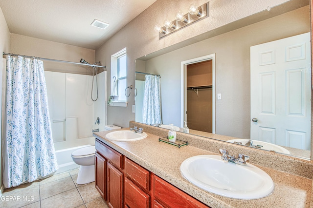 full bathroom with visible vents, a sink, and toilet