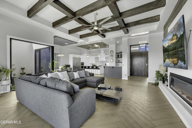 784 Brunswick Pl, Horizon City, TX 79928 - living room with baseboards, ceiling fan, beam ceiling, coffered ceiling, and a glass covered fireplace