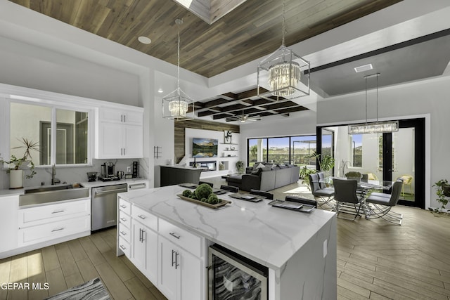784 Brunswick Pl, Horizon City, TX 79928 - kitchen featuring stainless steel dishwasher, an inviting chandelier, beverage cooler, and a sink
