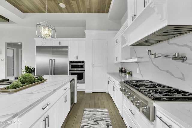 784 Brunswick Pl, Horizon City, TX 79928 - kitchen featuring a chandelier, white cabinets, under cabinet range hood, stainless steel appliances, and wood ceiling