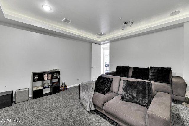 784 Brunswick Pl, Horizon City, TX 79928 - living area with visible vents, baseboards, a tray ceiling, and carpet flooring
