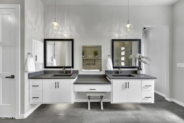 784 Brunswick Pl, Horizon City, TX 79928 - bathroom featuring a sink, baseboards, and two vanities