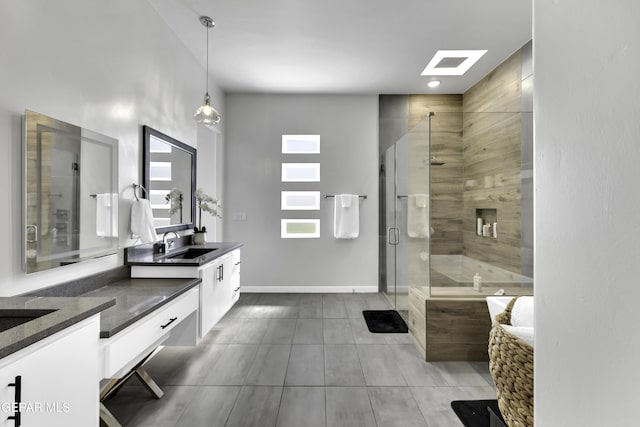 784 Brunswick Pl, Horizon City, TX 79928 - full bath featuring tile patterned flooring, baseboards, a stall shower, and vanity
