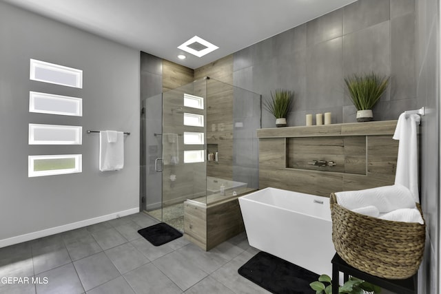784 Brunswick Pl, Horizon City, TX 79928 - bathroom with baseboards, a soaking tub, recessed lighting, tile patterned floors, and a stall shower