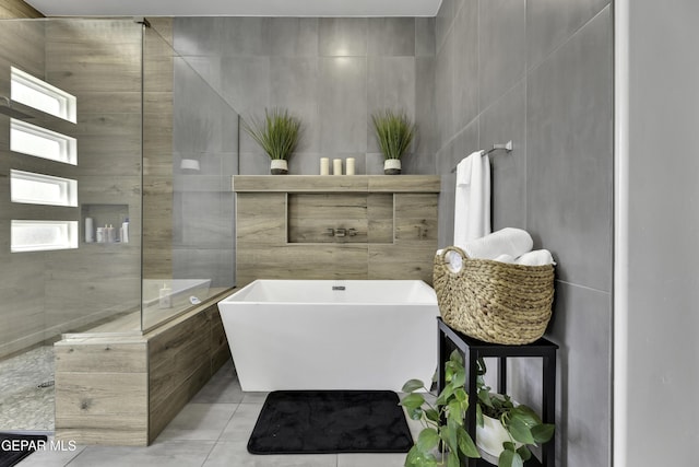 784 Brunswick Pl, Horizon City, TX 79928 - full bath featuring tile patterned floors, tile walls, and a freestanding bath