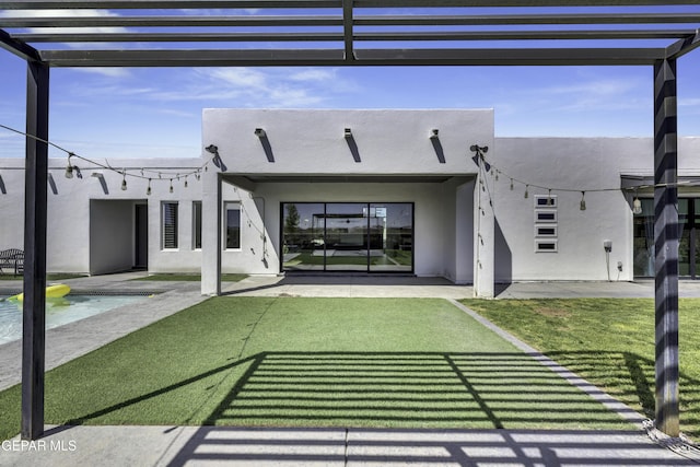 784 Brunswick Pl, Horizon City, TX 79928 - rear view of property with a patio, a yard, a pergola, and stucco siding