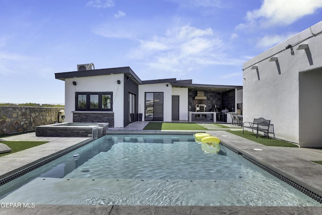 784 Brunswick Pl, Horizon City, TX 79928 - rear view of house with a pool with connected hot tub, stone siding, a fireplace, a patio, and stucco siding