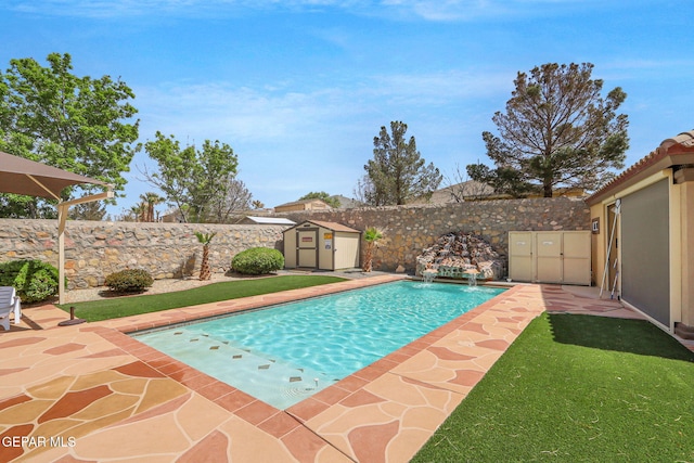 view of swimming pool with an outbuilding, a fenced backyard, a storage shed, and a patio