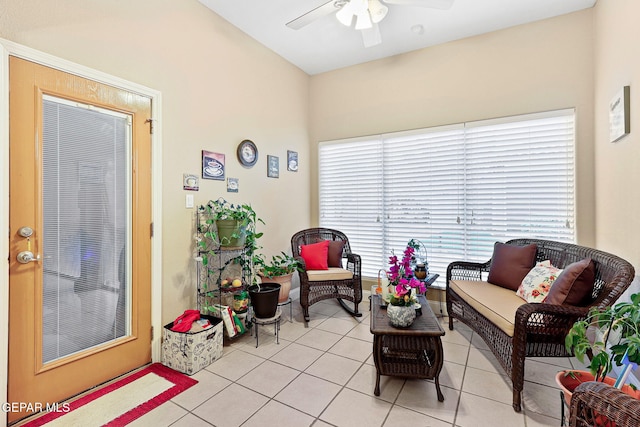 interior space with light tile patterned flooring and a ceiling fan