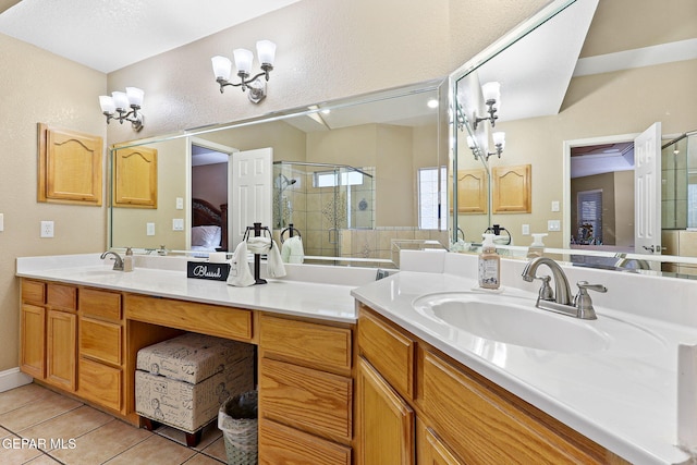full bath featuring tile patterned flooring, double vanity, a sink, and a stall shower