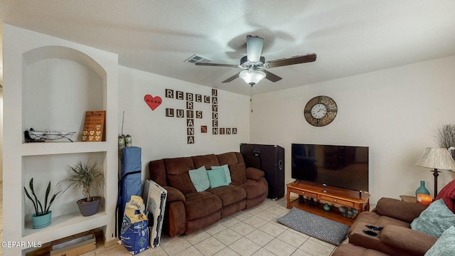 living room with light tile patterned floors, a ceiling fan, and visible vents