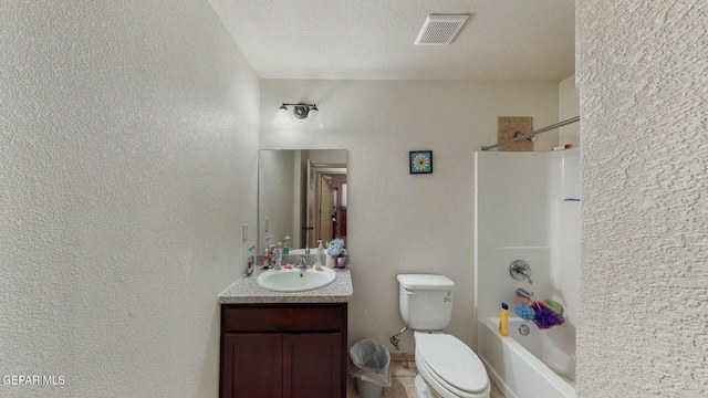 full bathroom with visible vents, toilet, a textured wall, vanity, and bathing tub / shower combination