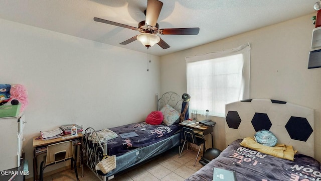 bedroom with tile patterned floors and ceiling fan