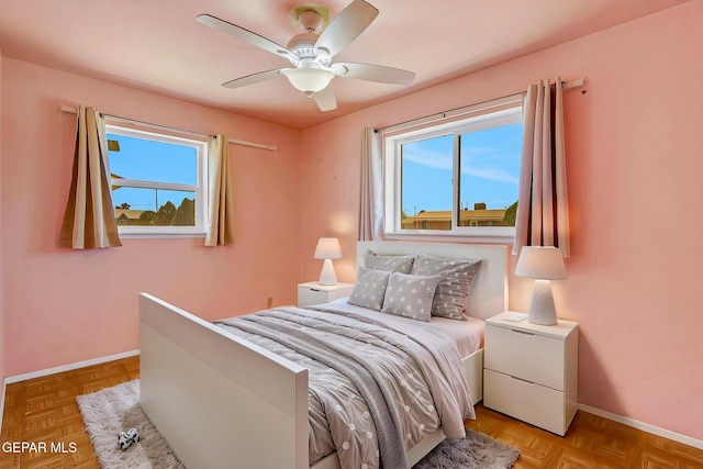 bedroom with baseboards and ceiling fan