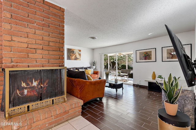 3705 Roslyn Dr, Horizon City, TX 79928 - living room featuring a textured ceiling and a fireplace