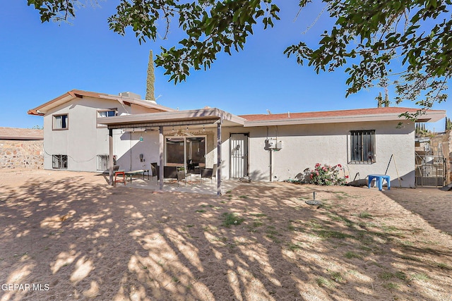 3705 Roslyn Dr, Horizon City, TX 79928 - rear view of property with stucco siding and a patio