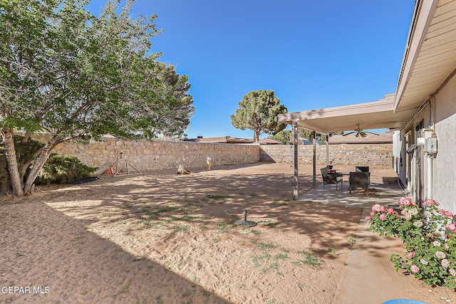 3705 Roslyn Dr, Horizon City, TX 79928 - view of yard featuring a patio, a ceiling fan, and a fenced backyard