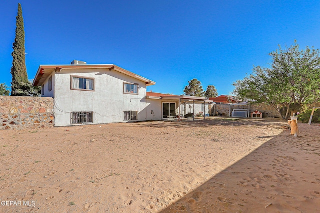 3705 Roslyn Dr, Horizon City, TX 79928 - rear view of property featuring a fenced backyard, a patio area, and stucco siding