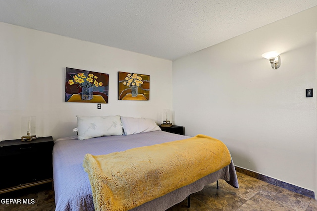 3705 Roslyn Dr, Horizon City, TX 79928 - bedroom with baseboards and stone finish floor