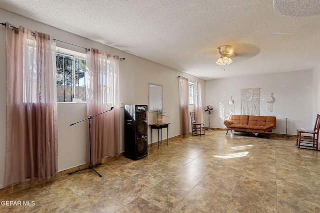 3705 Roslyn Dr, Horizon City, TX 79928 - sitting room featuring a textured ceiling